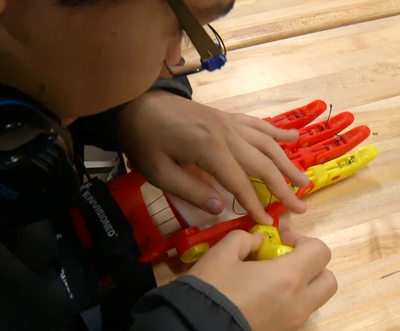 A student works on the creation of a prosthetic hand